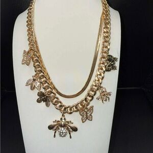 Gold Insect Charm Necklace bee and butterfly necklace.  New without tags.